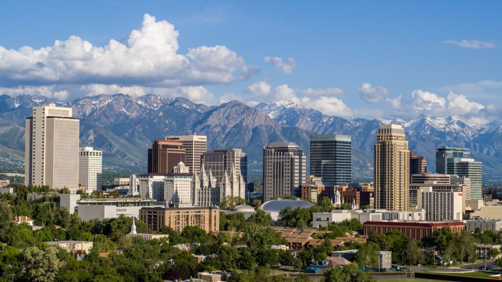 Downtown Salt Lake City, with the mountains of Salt Lake County behind it